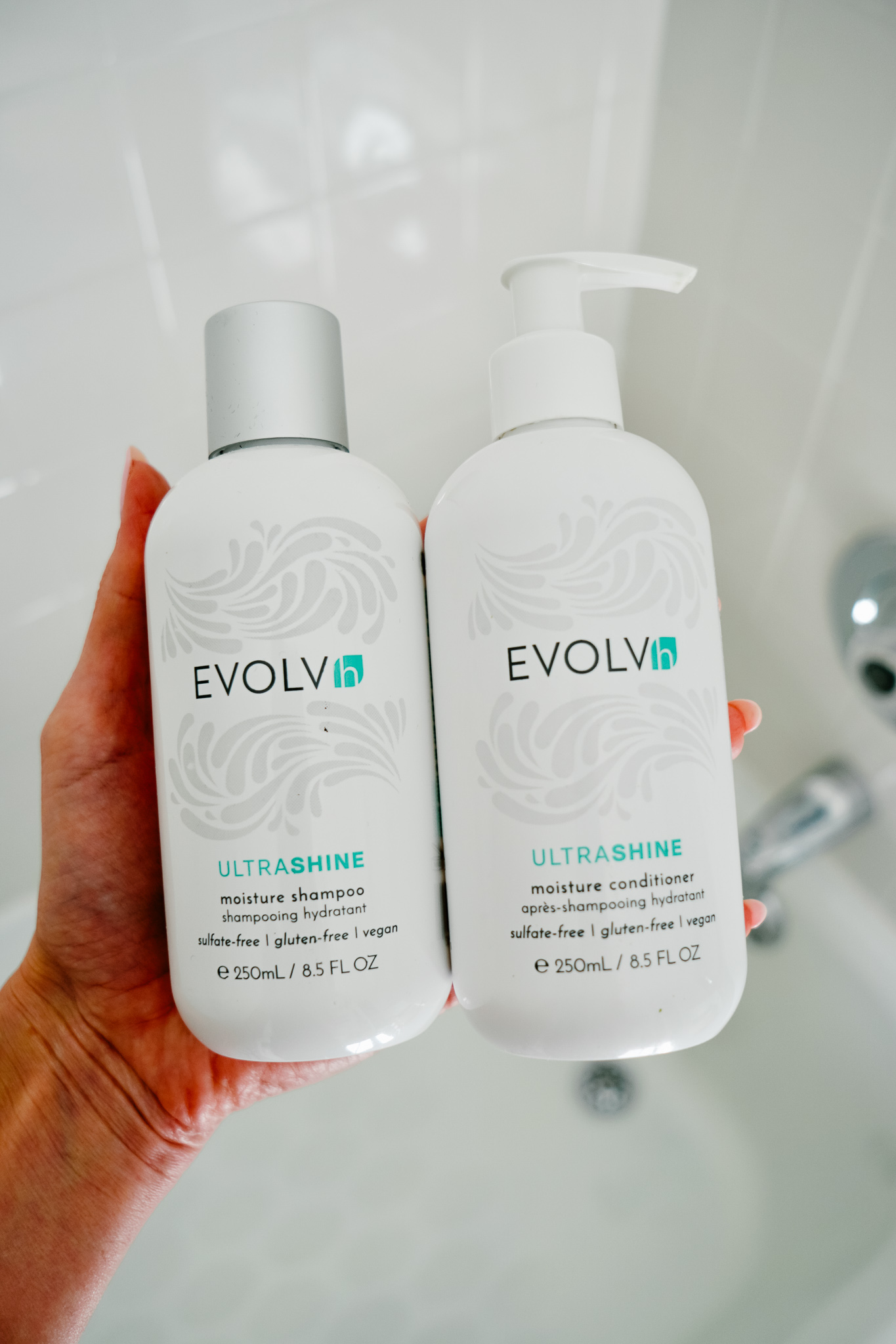 Holding Evolvh Shampoo and Conditioner