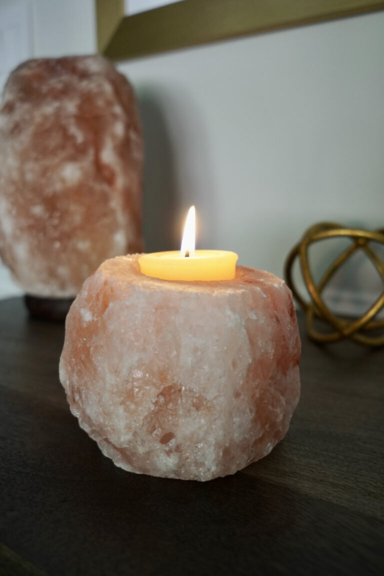 Cozy scene with a burning soy wax candle, showcasing longer burning time and cleaner burn.