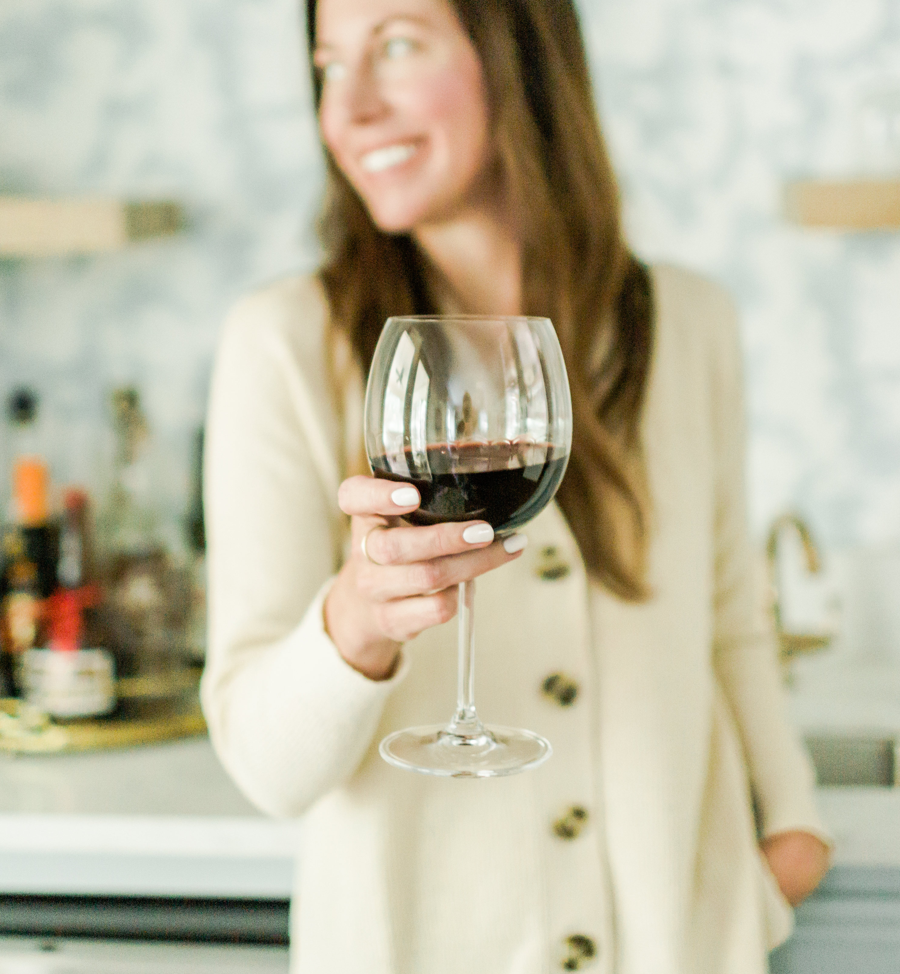 Lifestyle photo of a woman with a glass of wine, highlighting the appeal of natural wine