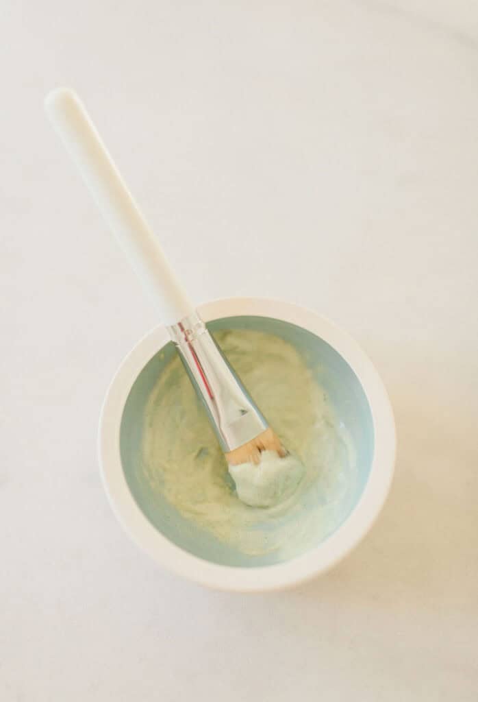 Natural manuka honey and clay face mask being prepared for use