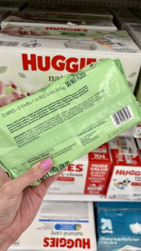 Looking at the ingredient list on a baby wipe package