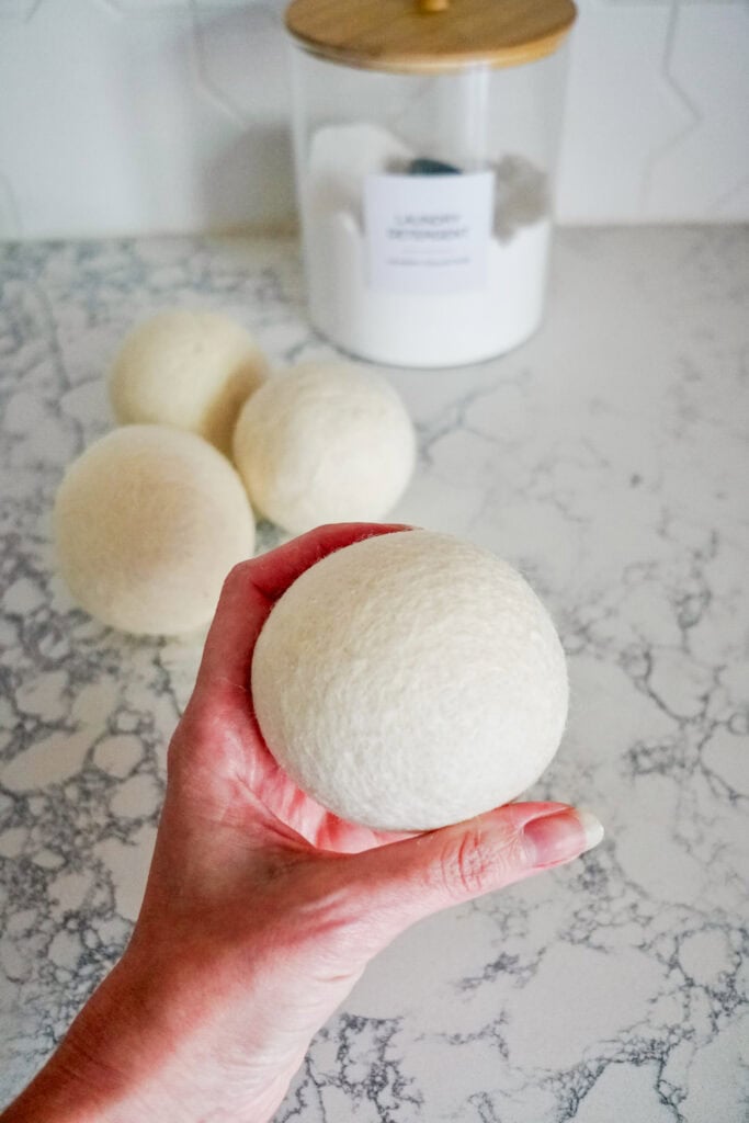 Holding up wool dryer ball