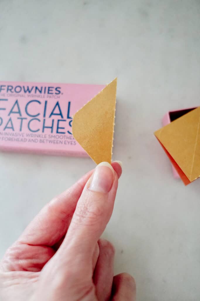Holding up a frownies wrinkle patch